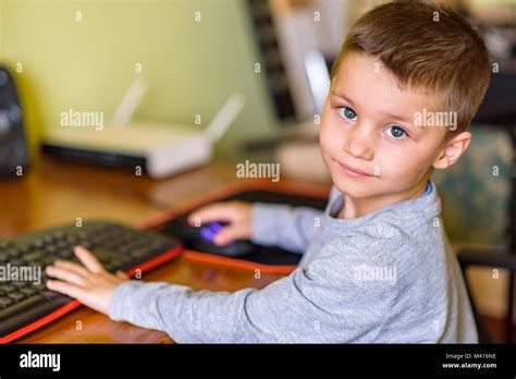 Young Boy Playing Games On A Desktop Computer Stock Photo Alamy