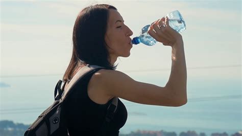Woman Traveler With Backpack Drinking Water Stock Footage Sbv 329525164