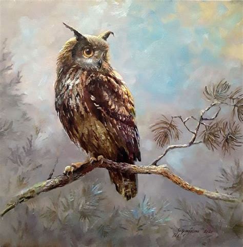 An Owl Sitting On Top Of A Tree Branch In Front Of A Blue And Yellow Sky