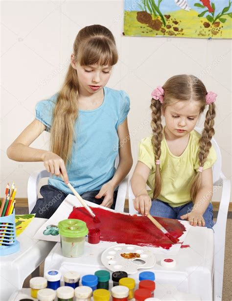 Child Painting In Preschool Stock Photo By ©poznyakov 6102136