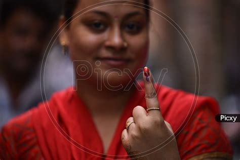 Image Of A Young Indian Girl Showing Inked Finger After Casting Her