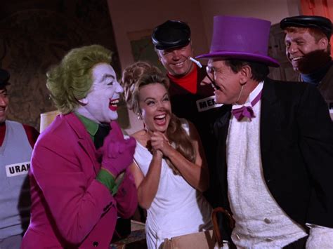 A Group Of People Dressed Up As The Joker And Other Characters In A