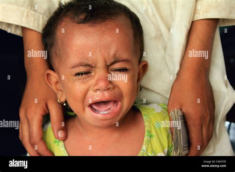 Refugee Child Cries In Hunger At A Refugee Camp Setup For Flood Victims