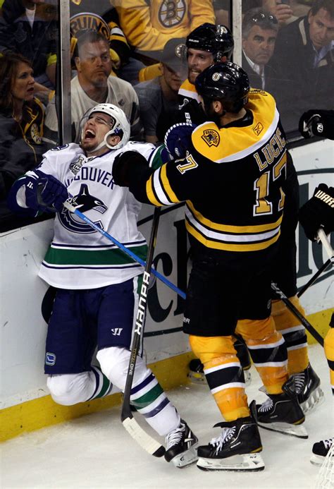 Sensing this rocket blast was about to go off, teammate alex burrows did what any of us would have done if we were in fact alex burrows: Alex Burrows Photos Photos - Vancouver Canucks v Boston Bruins - Game Three - Zimbio