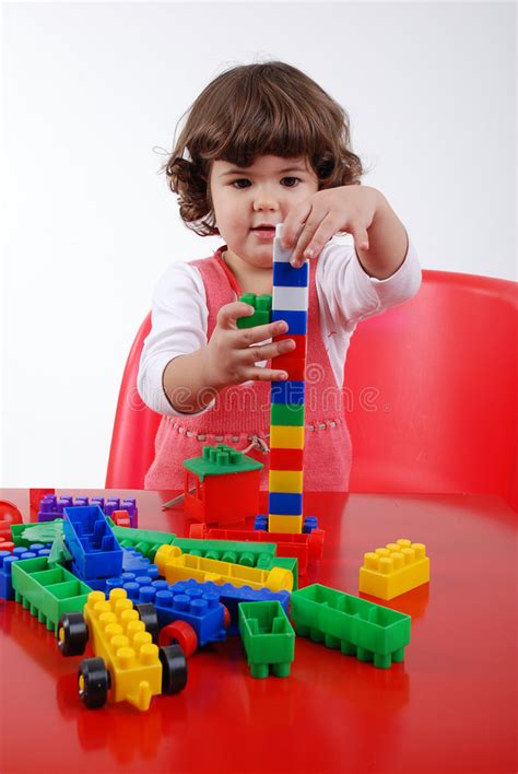 Child playing with block stock photo. Image of shot ...