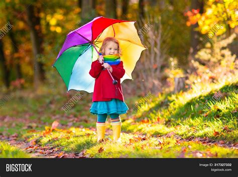 Kid Umbrella Playing Image And Photo Free Trial Bigstock