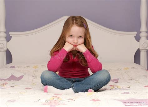 Young Girl Sitting On Bed Royalty Free Stock Images Image 12809549