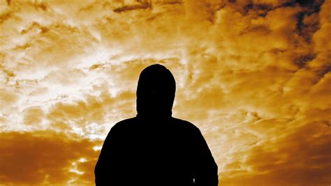 Hooded Person With Surreal Sky Stock Video Footage Storyblocks