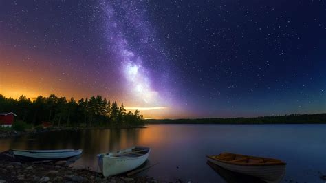 Peaceful Lake Boats Wooden House Forest Sky With Stars Night