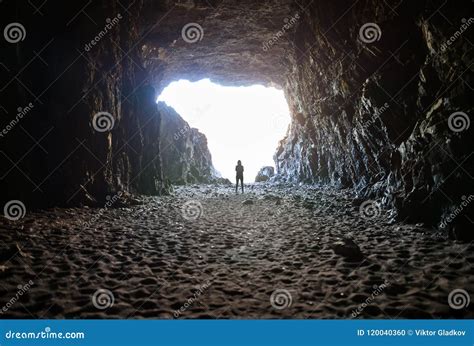Silhouette Of A Cave Explorer In The Underground Stock Photography