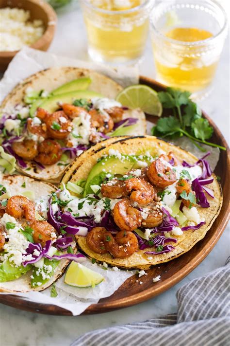 Spicy pan grilled shrimp tacos loaded with a zest honey cilantro lime slaw and topped with a creamy sriracha sauce. Shrimp Tacos with Cilantro Lime Crema | Shrimp tacos ...