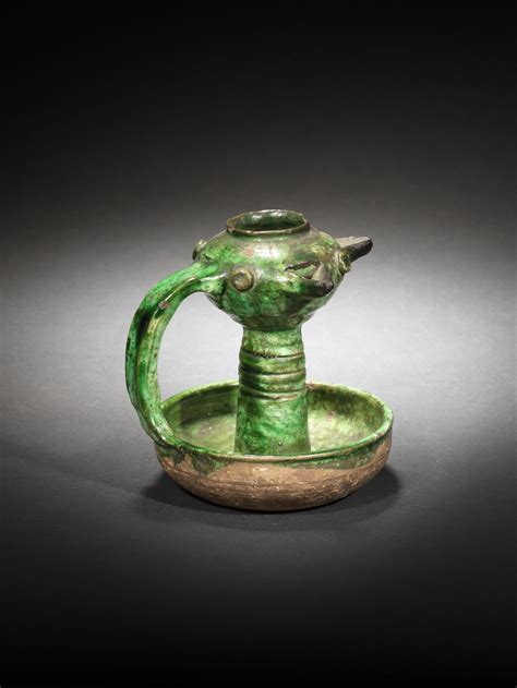 bonhams a monochrome pottery lamp persia 12th century