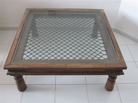 The wooden center table is a necessary piece of furniture for a living room. umm suqueim furniture sale: Square Wooden and Glass Center ...