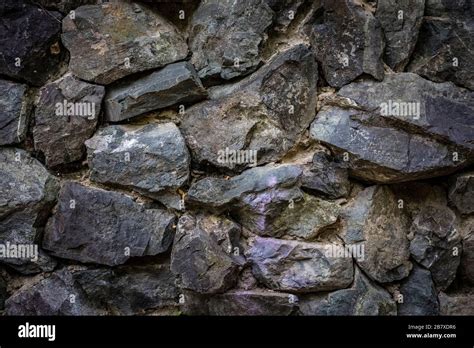 Part Of The Stone Wall For Background And Texture Rough Cut Natural