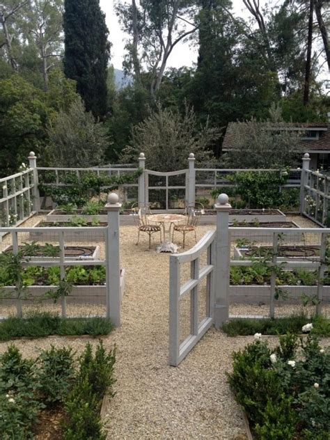 A formal outdoor space with a gravel and a gravel garden path lined with large rocks that help to keep the gravel in place and add a wild look. New Pea Gravel Patio Project! & Backyard Inspiration - The ...