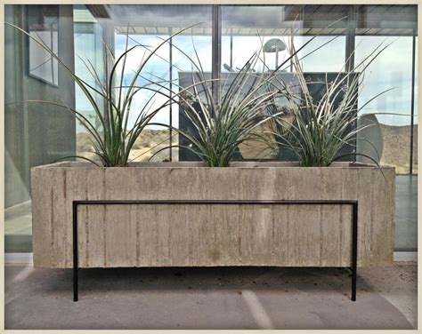 This planter offers another solution for an area where you might like a privacy screen but where you also want to let in sunlight and a breeze. Concrete Planter by TK Smith « TK Smith