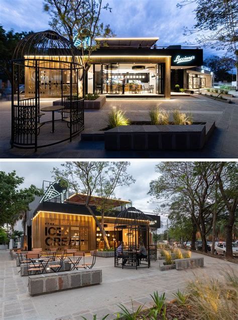 This Modern Cafe Has An Outdoor Seating Area That Features Two Giant