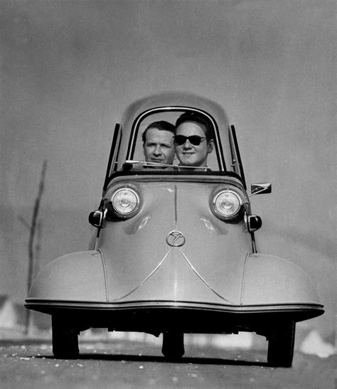 ralph crane front shot of two men riding in the three wheeled german made messerschmidt 1954