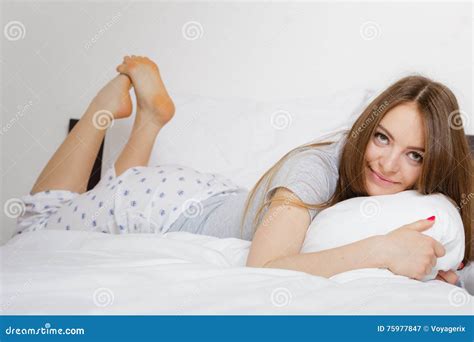 cheerful girl rolling in bed stock image image of lazy bedroom 75977847
