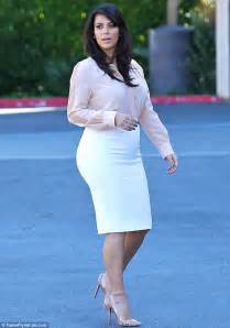 Kim Kardashian Emphasises Her Curvy Rear In White Pencil Skirt As