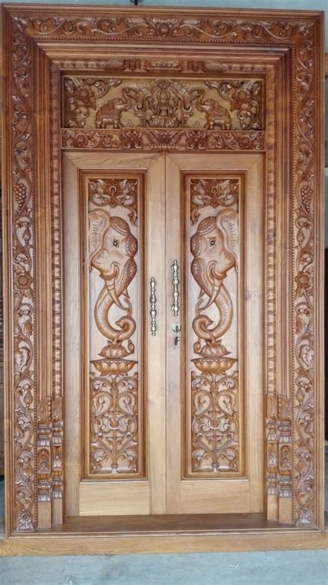 An Ornate Wooden Door With Carvings On It
