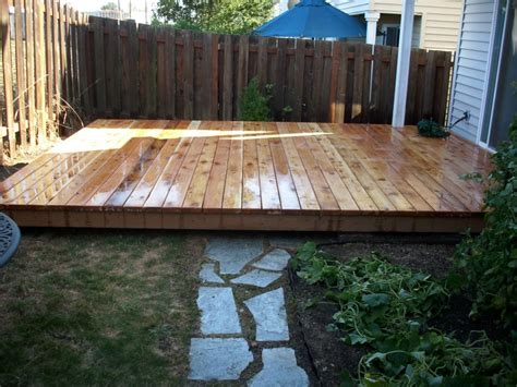 Please click on any project picture for before and after photos. Ground level cedar deck | Deck Masters, LLC