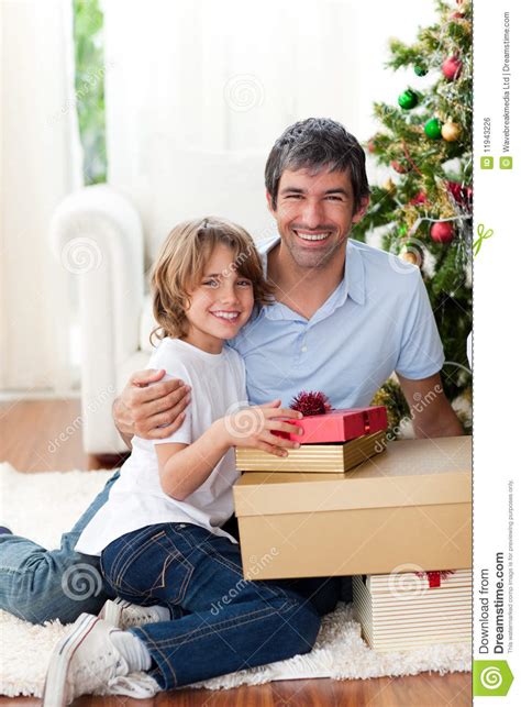 The best gifts for dads for christmas﻿, birthdays, and every holiday in between. Father And His Son Opening Christmas Gifts Stock Photo ...