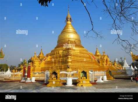 Golden Pagoda At Buddhist Temple Under Clear Blue Sky Kuthodaw Pagoda