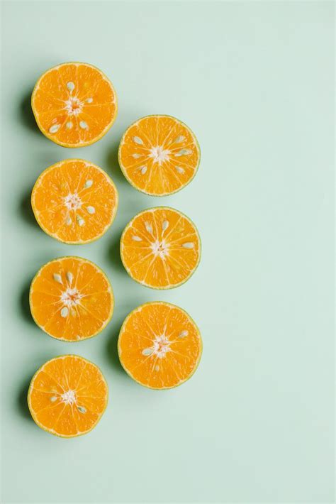Composition Of Sliced Fresh Oranges On Green Background · Free Stock Photo