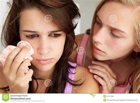 Teenage Girl Comforting Tearful Friend Stock Photos