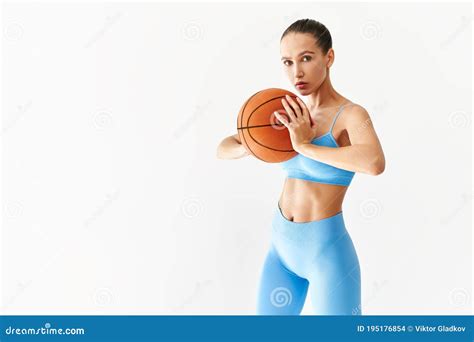 Portrait Of Beautiful Girl With A Basketball On White Background With