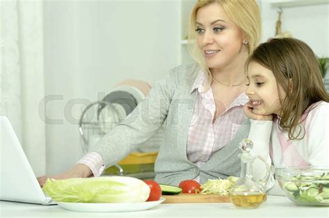 Mother And Daughter Cooking In Kitchen Stock Image Colourbox