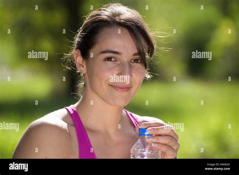 Beautiful Athletic Girl Drinking Water After Exercising Stock Photo Alamy