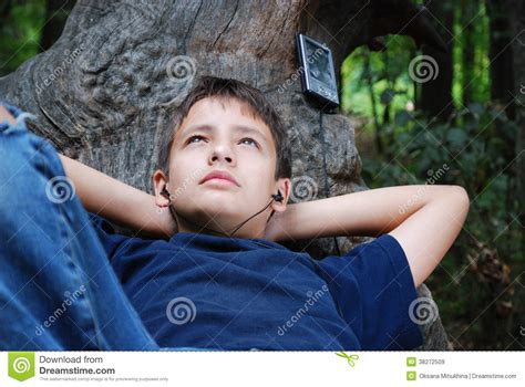 Relaxed boy with a gadget stock image. Image of teenager - 38272509