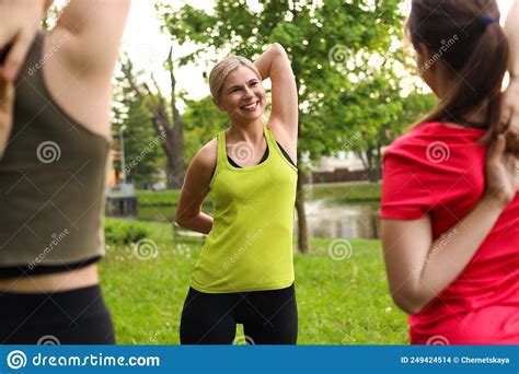 Women Doing Morning Exercise Together In Park Stock Photo Image Of
