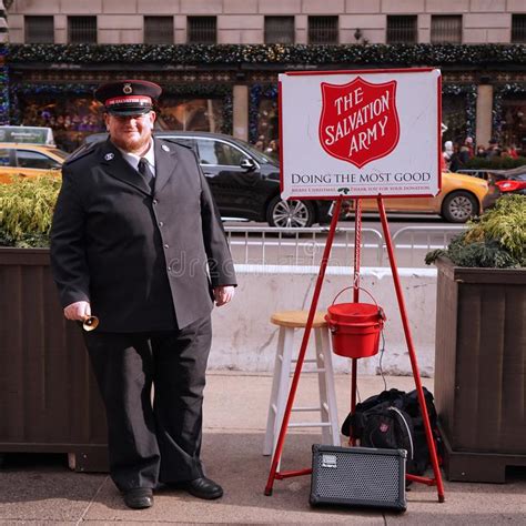Salvation Army Soldier Performs For Collections In Midtown Manhattan