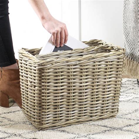 It has a black iron base strung with handwoven leather straps throughout the seat and back in a classic basketweave pattern. Woven Wicker Magazine Basket | Wicker, Basket, Rattan