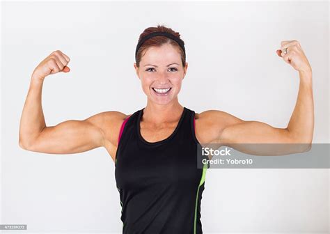 Strong Beautiful Woman Flexing Her Muscles Stock Photo Download Image