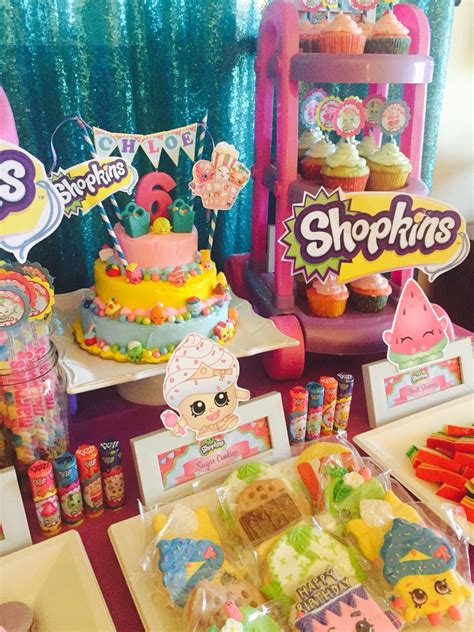 shopkins dessert buffet featuring rainbow jello french macarons sugar cookies and cupcakes