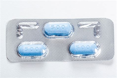 Three Blue Antibiotic Pills In A Pack View From Above Creative