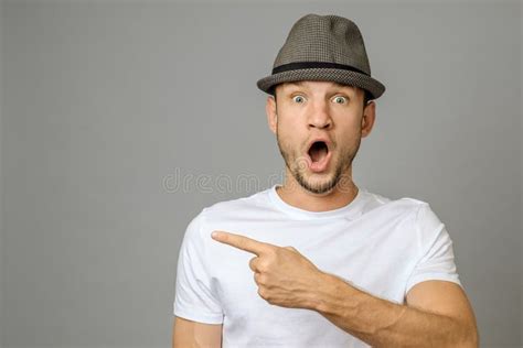 Surprised Young Man Pointing Copy Space Stock Photo Image Of Casual