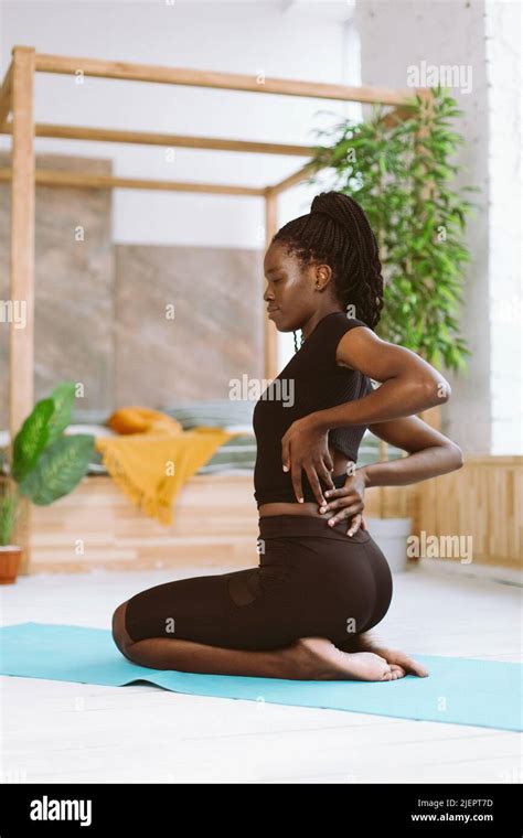 Vertical Multiracial Woman With Dreadlocks Stretching Do Yoga Exercises Sit On Bending Legs