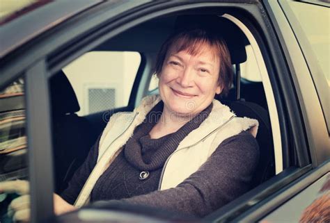 Happy Mature Woman Sitting In New Car Stock Image Image Of Retired