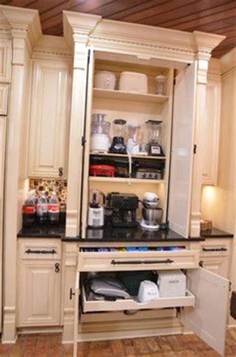 Hide it in an appliance garage. appliance cabinet for microwave, toaster, mixer etc. fold ...