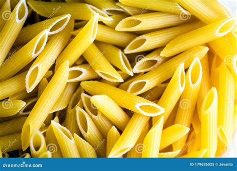 Raw Italian Penne Rigate Macaroni Pasta Inside Clear Packaging Stock