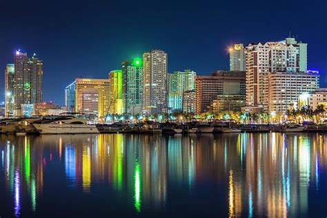 Manila City Skyline At Night By Stuart Dee