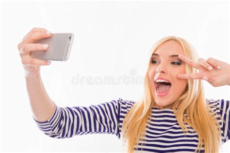 Happy Smiling Girl Making Comic Selfie And Holding Fingers Near Eyes
