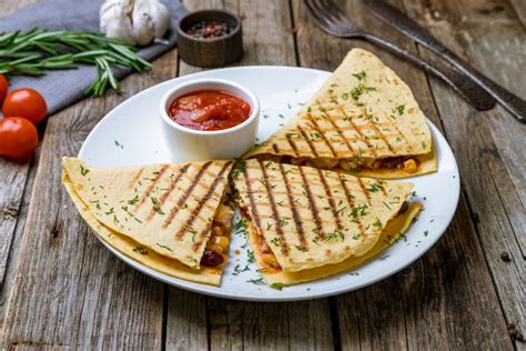 To reheat several quesadillas at once, place them in a single layer on a baking sheet in a 350°f preheated oven and heat 5 to 10 minutes. Must Have Chicken Quesadilla Recipe | LEAFtv
