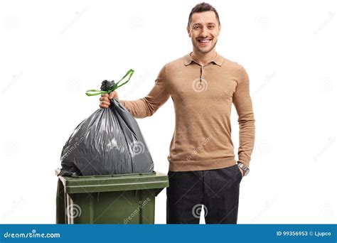 Young Man Throwing Out The Garbage And Smiling Stock Image Image Of