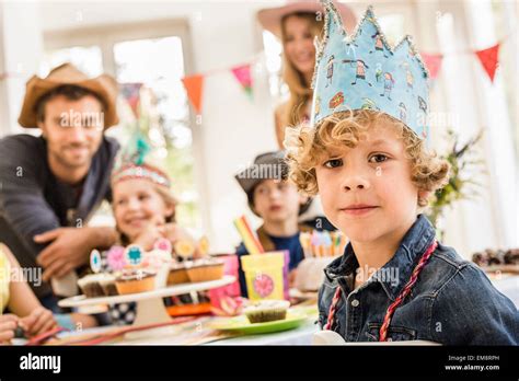 Portrait Of Boy Wearing Party Hat At Birthday Party Stock Photo Alamy